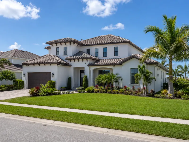Florida home with a finished tile roof and landscaped front yard